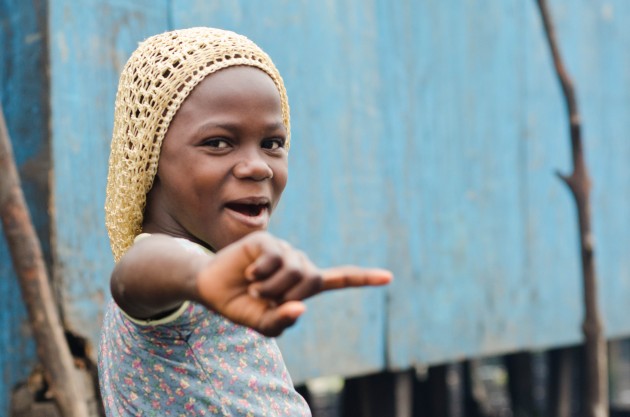 Children's reactions to my camera were mostly positive. This young girl playfully wagged her finger when she saw me. (MPR Photo/Nate Minor)