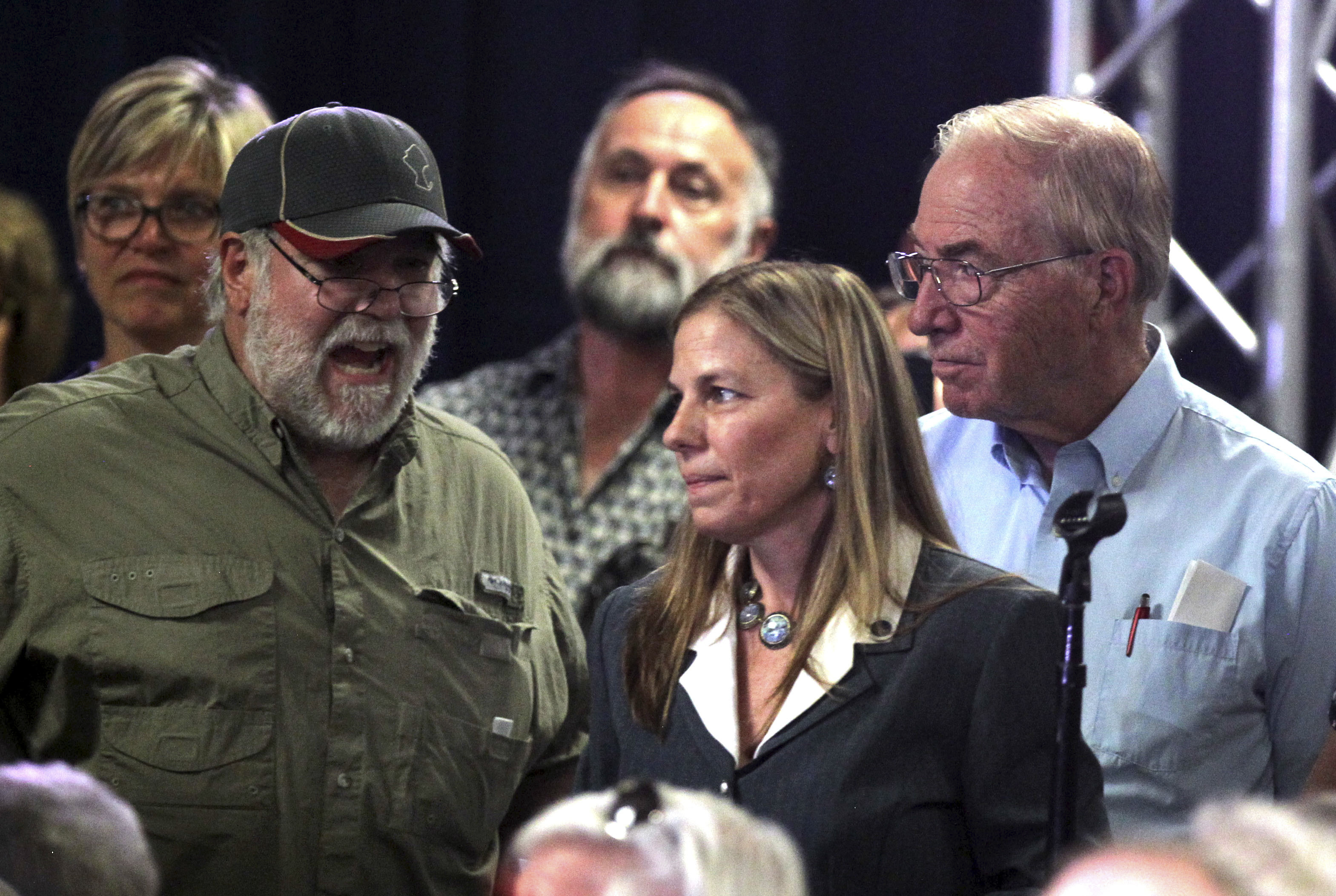 Republican vice presidential candidate Gov. Mike Pence, R-Ind., quieted the crowd at a campaign rally in Carson City, Nev., that was loudly booing a women who asked Pence, how he can tolerate what she said was Donald Trump's constant disrespect of American serviceman. Monday, August 1, 2016. (AP Photo/Lance Iversen)